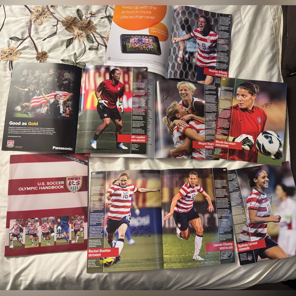 USWNT Handbook and autographed photos
